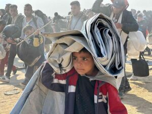 Return of displaced people via Al Rasheed Street after ceasefire January 2025 Gaza Strip 768x576